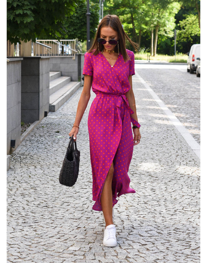 Chic women's printed wrap midi dress, mid-calf length. V-neck, short sleeves, & tie waist for an elegant spring look.