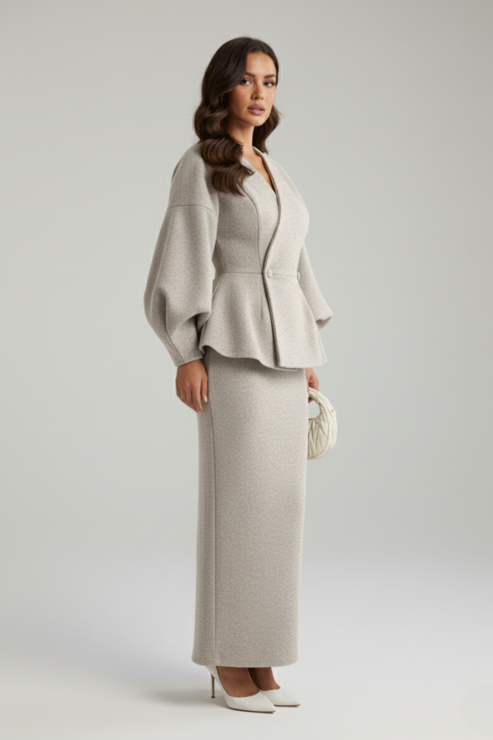 Chic women's midi skirt, part of a two-piece co-ord set with a puff sleeve blazer for formal wear.