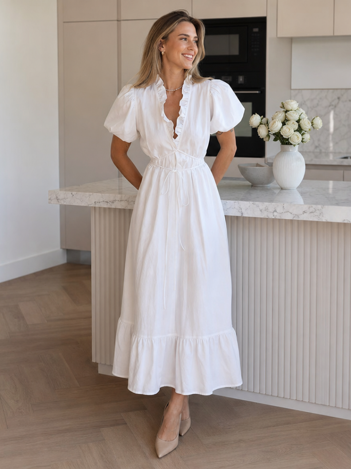 Elegant women's puff sleeve midi dress with waist tie. Versatile button-front summer dress, perfect for warm weather.