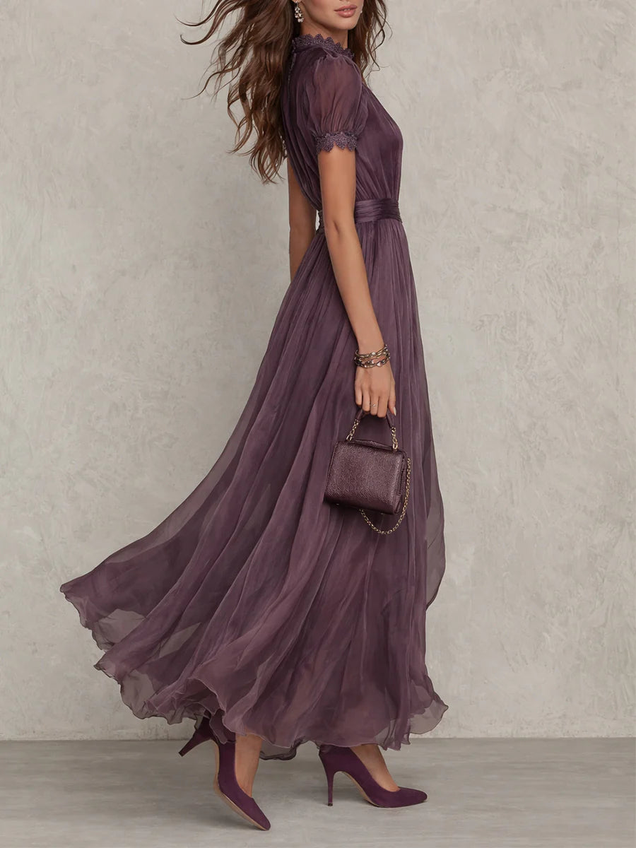 Flowing women's purple pleated maxi dress, featuring stylish puff sleeves & keyhole detail. Summer fashion.