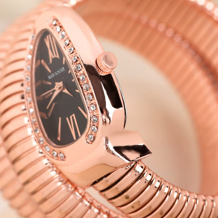 Chic women's quartz watch, rose gold-tone snake band, a beautiful fashion piece.