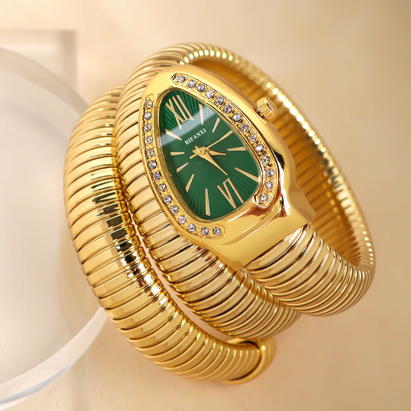 Fashion women's silver-tone snake design quartz watch, bracelet style, modern.