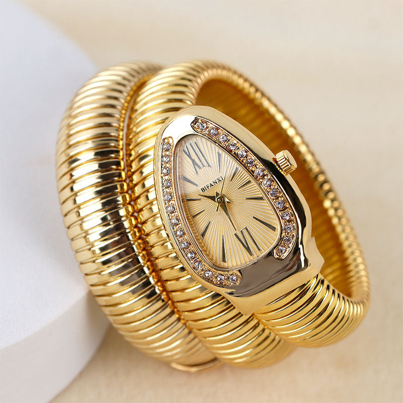 Silver-tone women's elegant quartz watch with a unique snake bracelet design.
