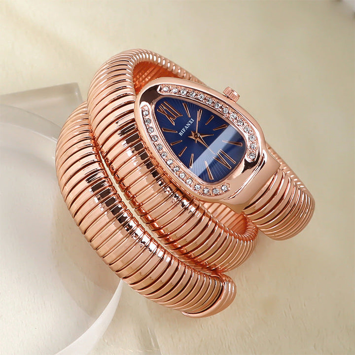 Stylish women's quartz watch, gold-tone snake-shaped bracelet, elegant jewelry.