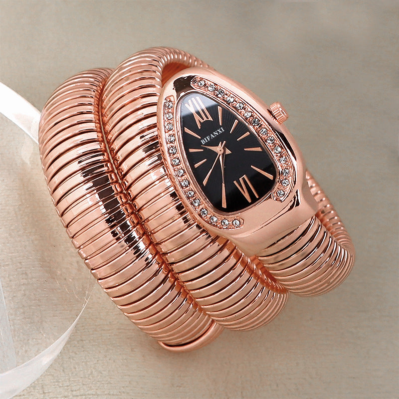 Elegant women's black dial quartz watch with a sleek rose gold snake bracelet.