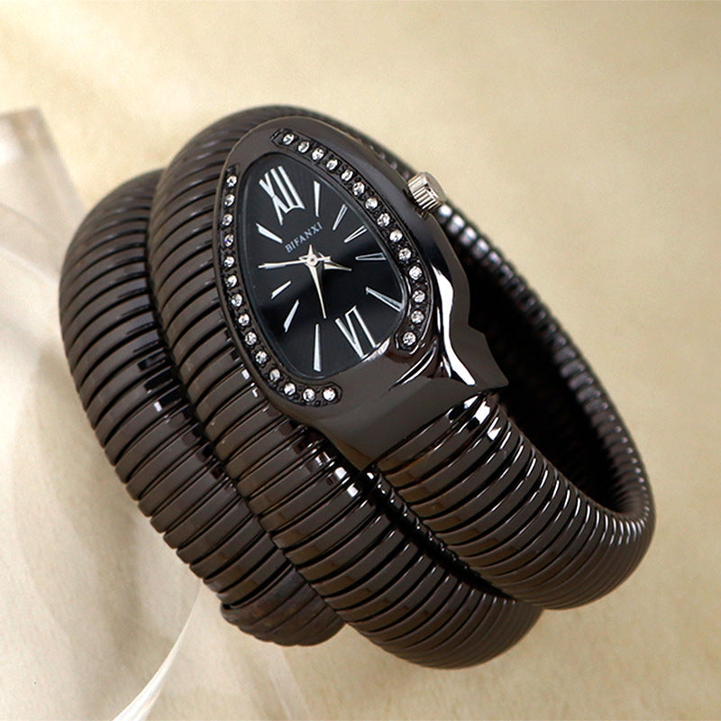 Women's quartz watch with a beautiful silver-tone snake bracelet, fashion accessory.