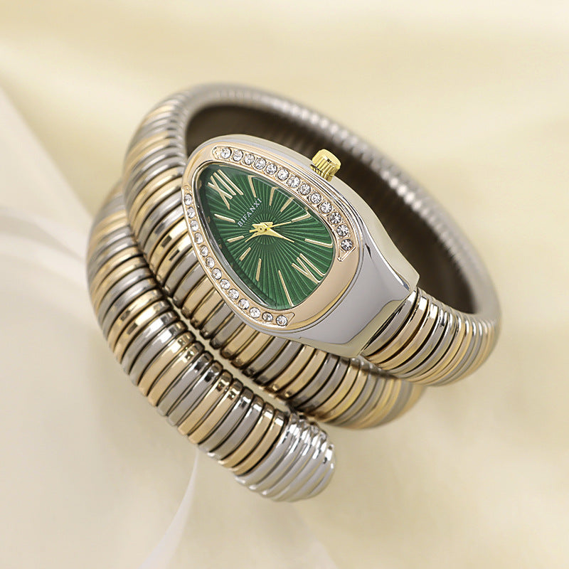 Rose gold-tone women's elegant snake bracelet watch, quartz movement, chic accessory.
