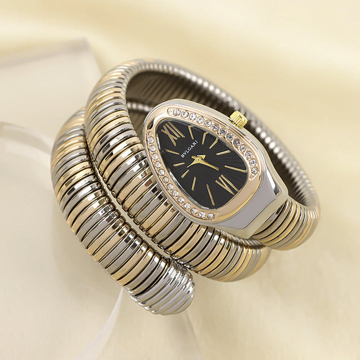 Stylish women's quartz watch, silver-tone snake design bracelet, elegant and modern.