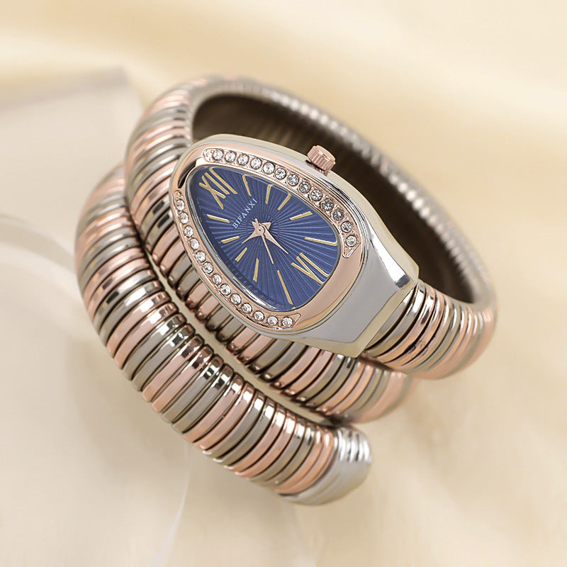 Gold-tone women's elegant snake jewelry watch, quartz movement, perfect for parties.