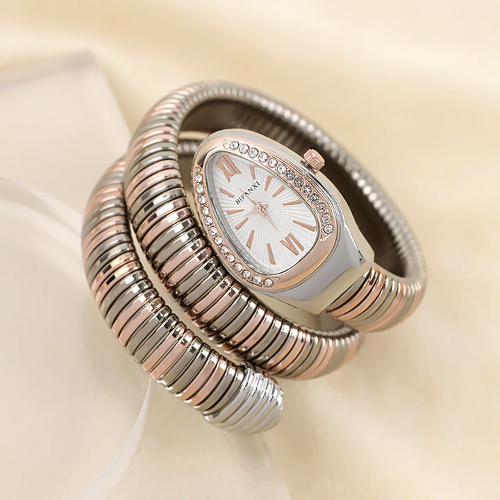 Elegant women's snake bracelet watch, quartz, black dial, sophisticated accessory.