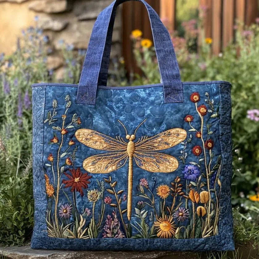 Elegant women's quilted tote bag featuring a delicate dragonfly design. Stylish shoulder bag for everyday fashion.