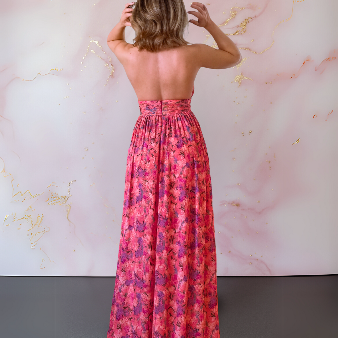 Sleeveless red maxi dress with a halter neck and front slit, a chic summer and party outfit for women.