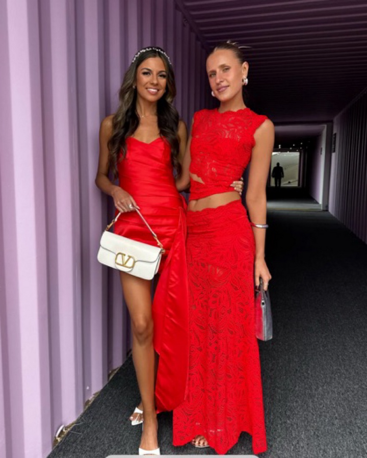Sexy red lace crop top and matching high-waisted skirt set for women; ideal party outfit.
