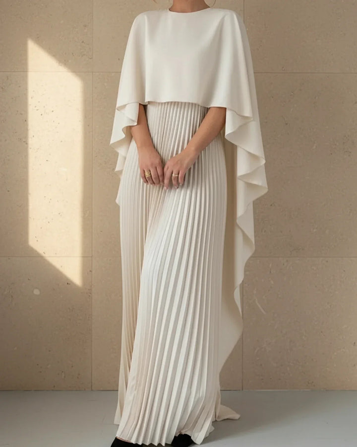 Stunning women's black formal maxi dress with a flowing pleated cape, ideal for evening events.