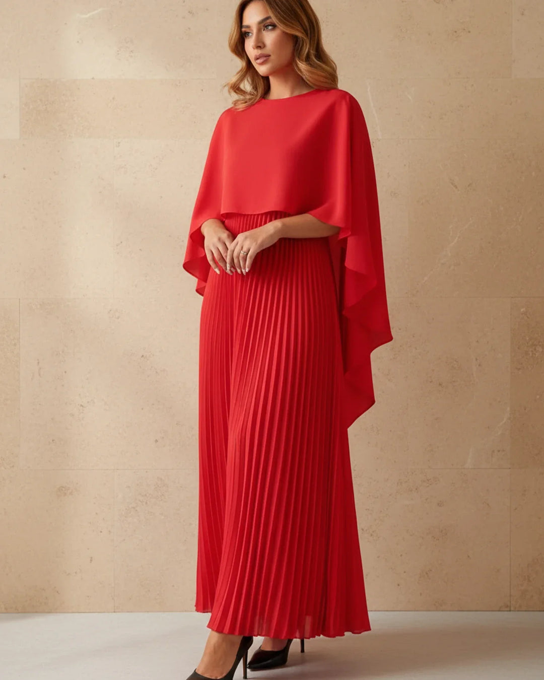 Women's elegant maxi dress featuring a stylish pleated cape, designed for formal events.