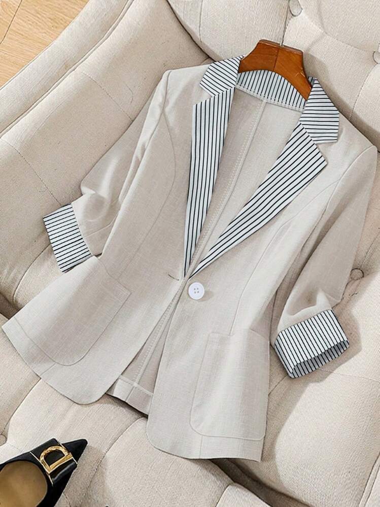 Spring/summer fashion: Women's elegant relaxed fit blazer jacket, a lightweight and versatile outerwear for style.