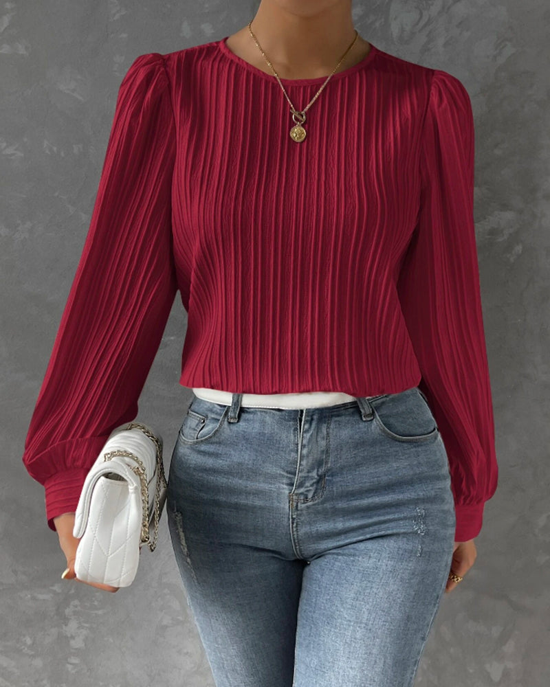 Women's graceful long sleeve round neck blouse. Effortlessly stylish top for work, fashion & everyday elegance.