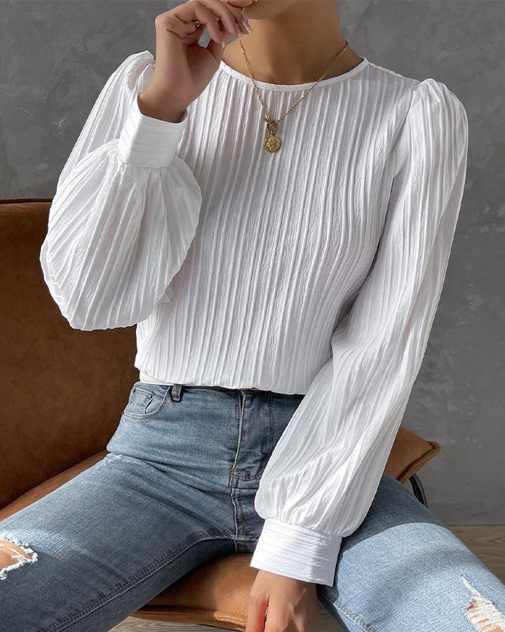 Classic women's round neck blouse, long sleeve. Chic and versatile, perfect for sophisticated work wear.