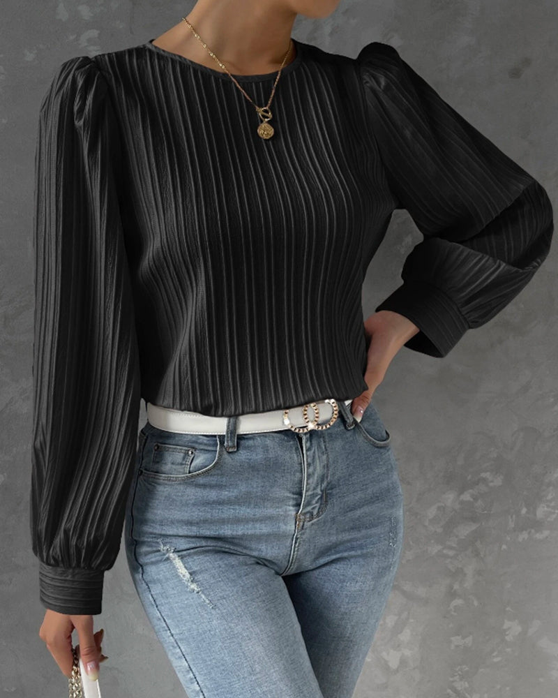 Effortless style women's round neck blouse. Long sleeve top, great for versatile fashion and work ensembles.