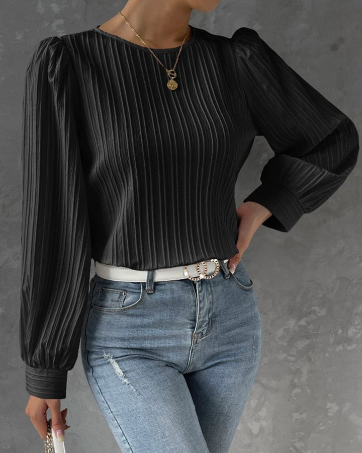 Effortless style women's round neck blouse. Long sleeve top, great for versatile fashion and work ensembles.