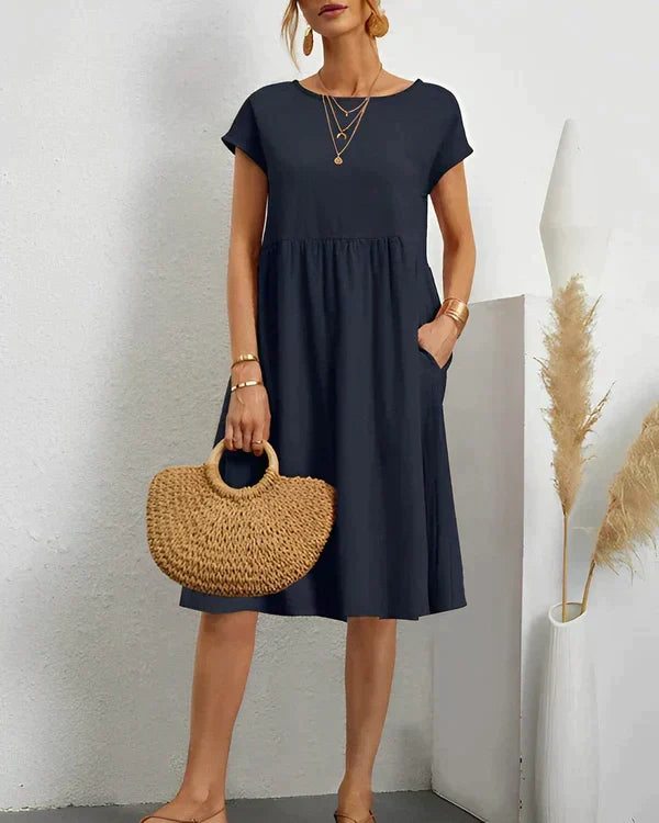 Comfortable classic round neck midi dress for women, offering elegant and versatile everyday style.