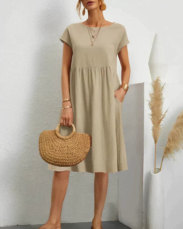 Versatile women's round neck midi dress, suitable for elegant casual and everyday occasions.