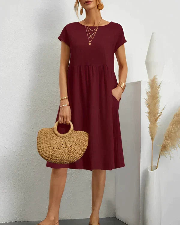 Chic women's midi round neck dress, combining elegance with versatile casual and everyday comfort.