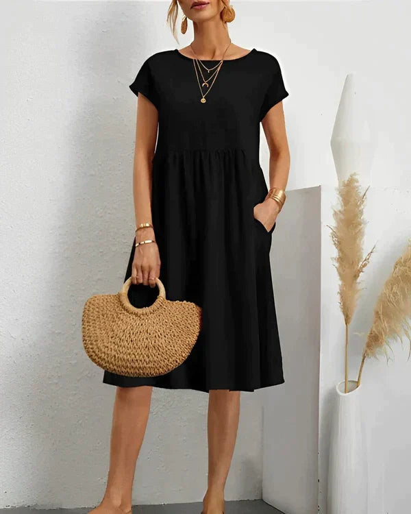 Simple yet elegant women's round neck midi dress, a versatile and comfortable choice for everyday.