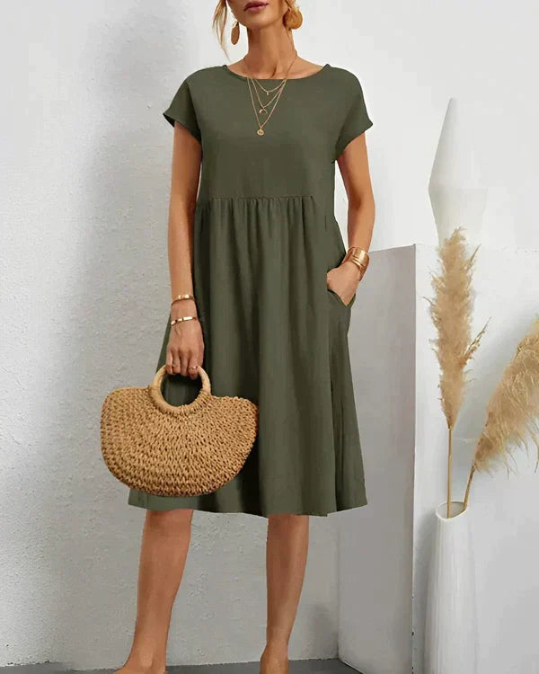 Modern classic women's round neck midi dress, offering elegant, versatile comfort for everyday casual wear.
