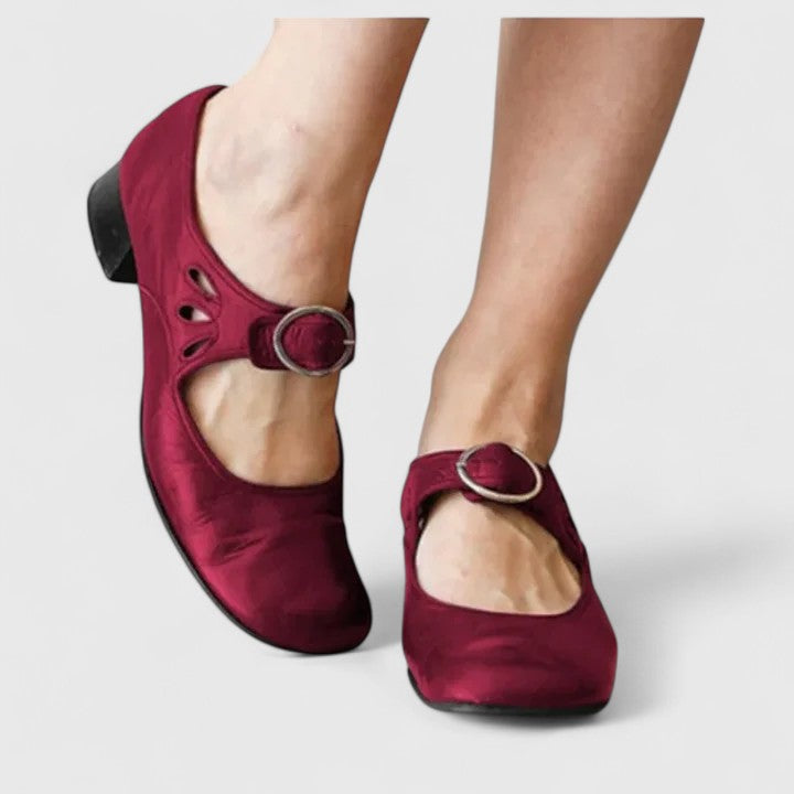 Classic women's round-toe high heels featuring a secure ankle strap, offering timeless style for any event.