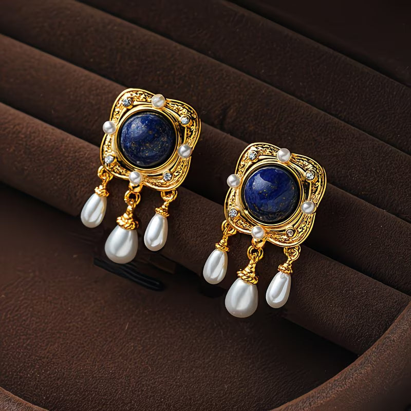Elegant women's royal blue pearl chandelier drop earrings, perfect statement jewelry for special occasions.