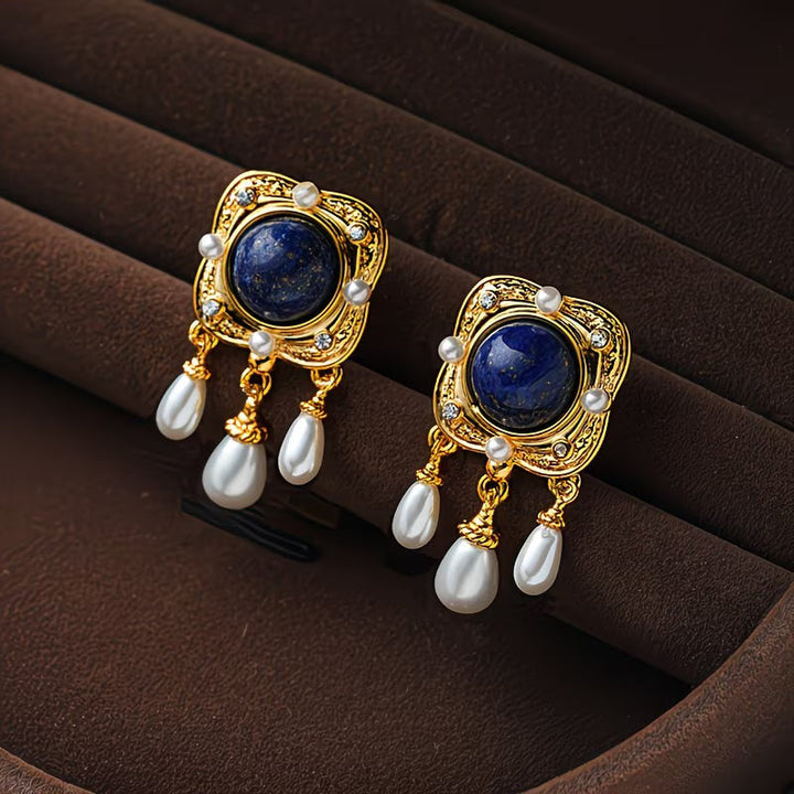 Elegant women's royal blue pearl chandelier drop earrings, perfect statement jewelry for special occasions.