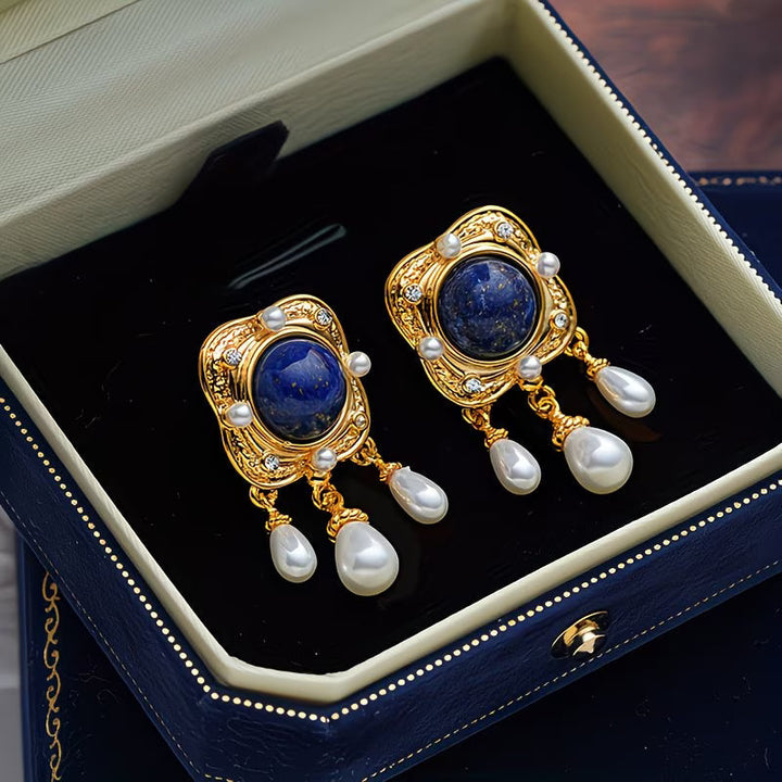 Stunning royal blue pearl drop chandelier earrings for women, featuring elegant design and sparkling accents.