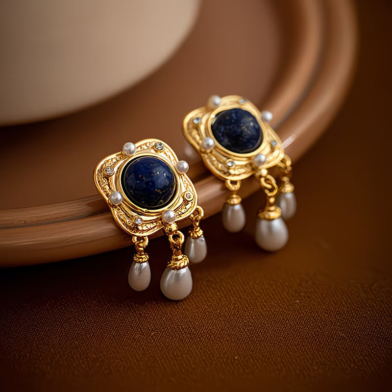 Luxurious women's royal blue pearl chandelier drop earrings, ideal for an elegant evening or fashion statement.