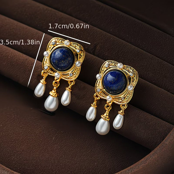 Fashionable royal blue pearl chandelier drop earrings for women, an elegant accessory to elevate any outfit.