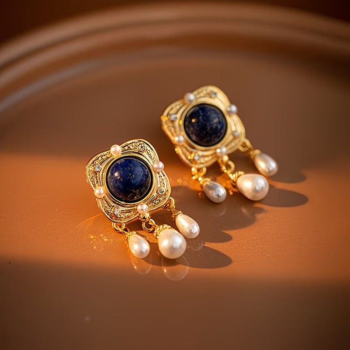 Eye-catching royal blue pearl chandelier drop earrings, a glamorous women's statement jewelry piece with pearls.