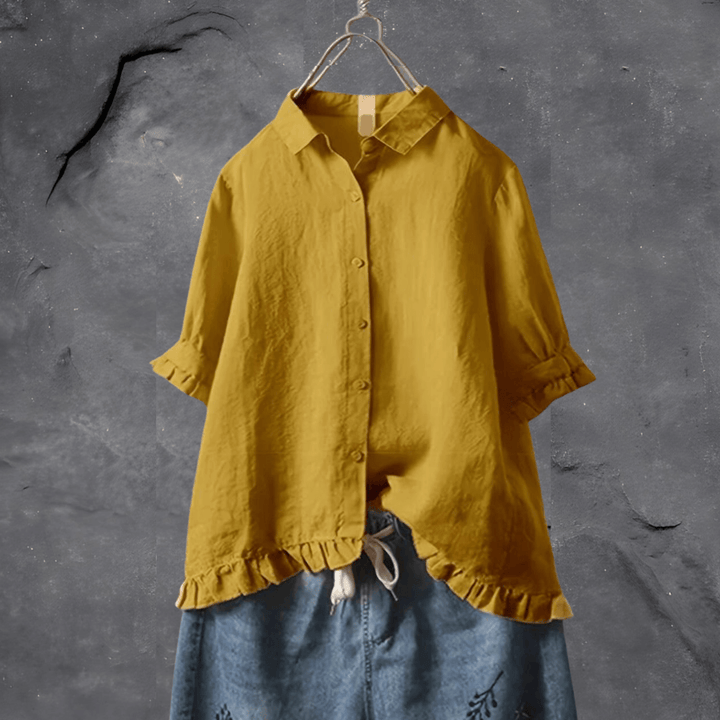Elegant women's ruffled hem short sleeve collared blouse with button-front, ideal for casual wear or professional settings.