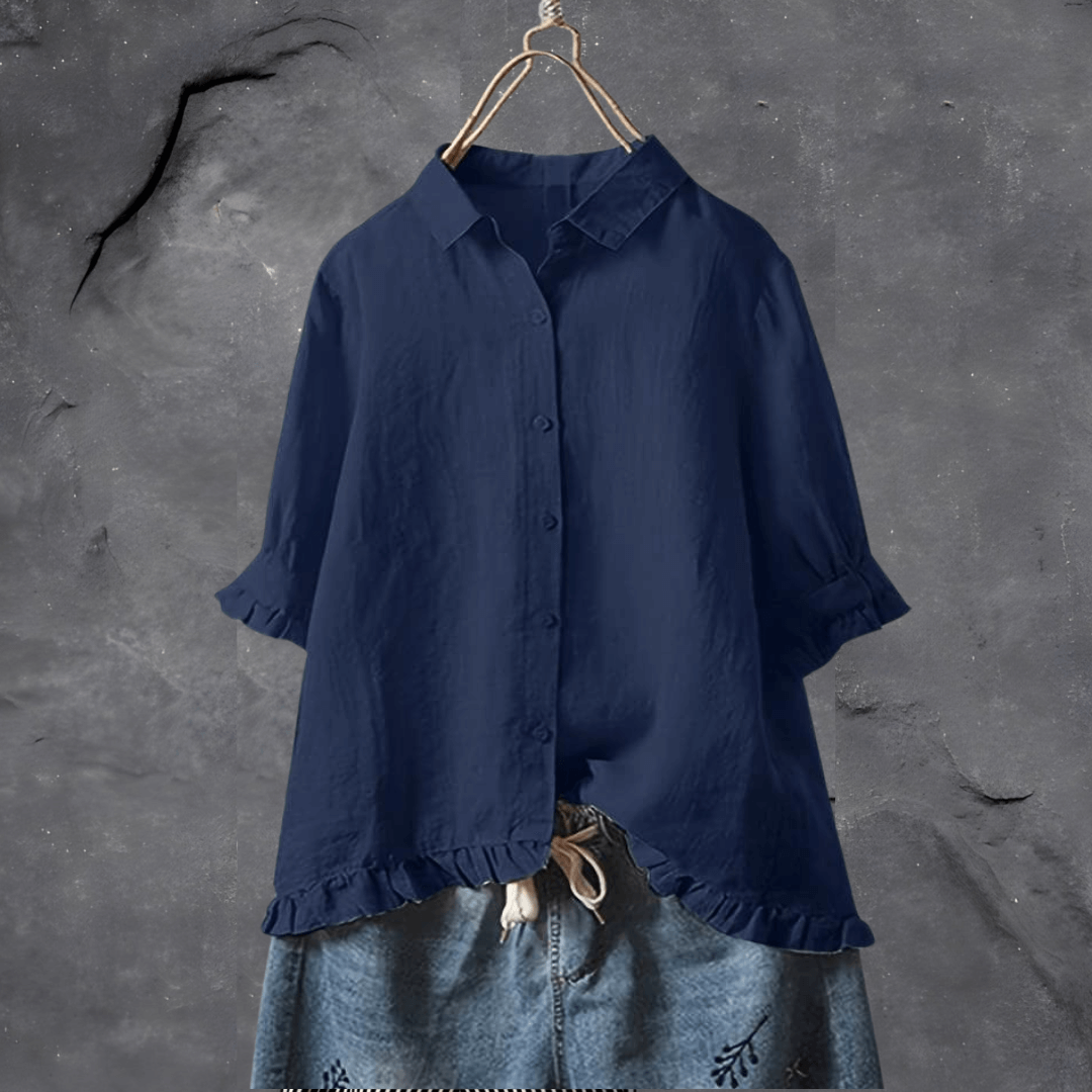 Stylish yellow women's short sleeve blouse featuring a collared design and charming ruffled hem. A versatile ladies top.
