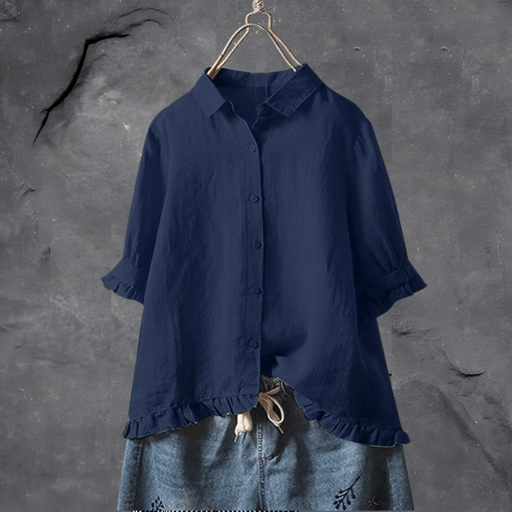 Stylish yellow women's short sleeve blouse featuring a collared design and charming ruffled hem. A versatile ladies top.