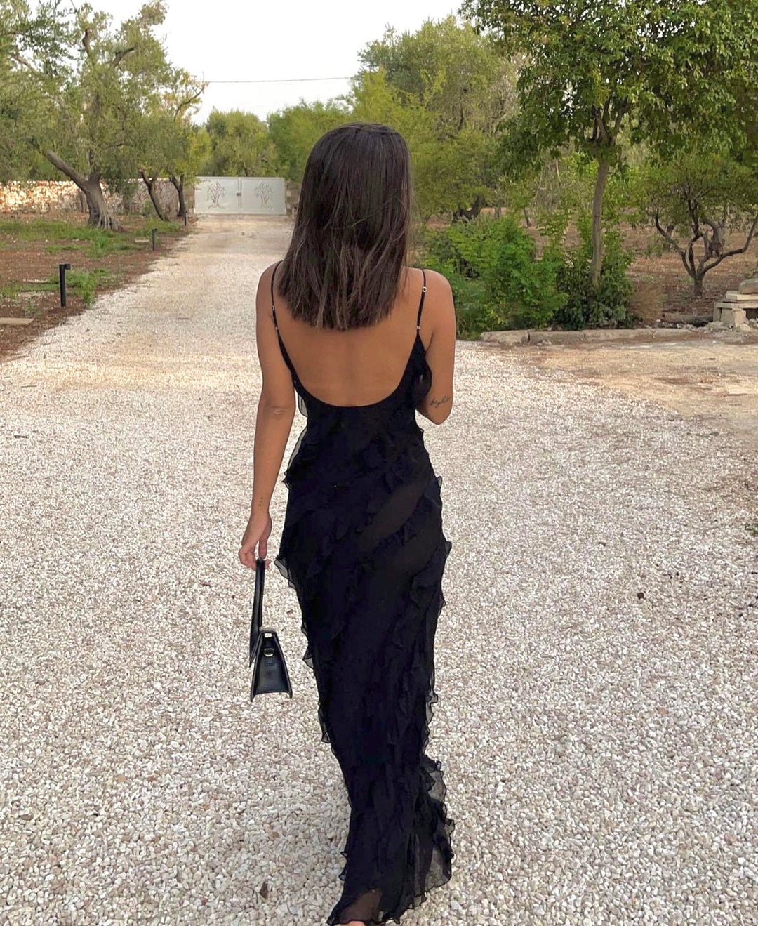 Women's formal ruffled V-neck maxi evening dress, perfect for special occasions.