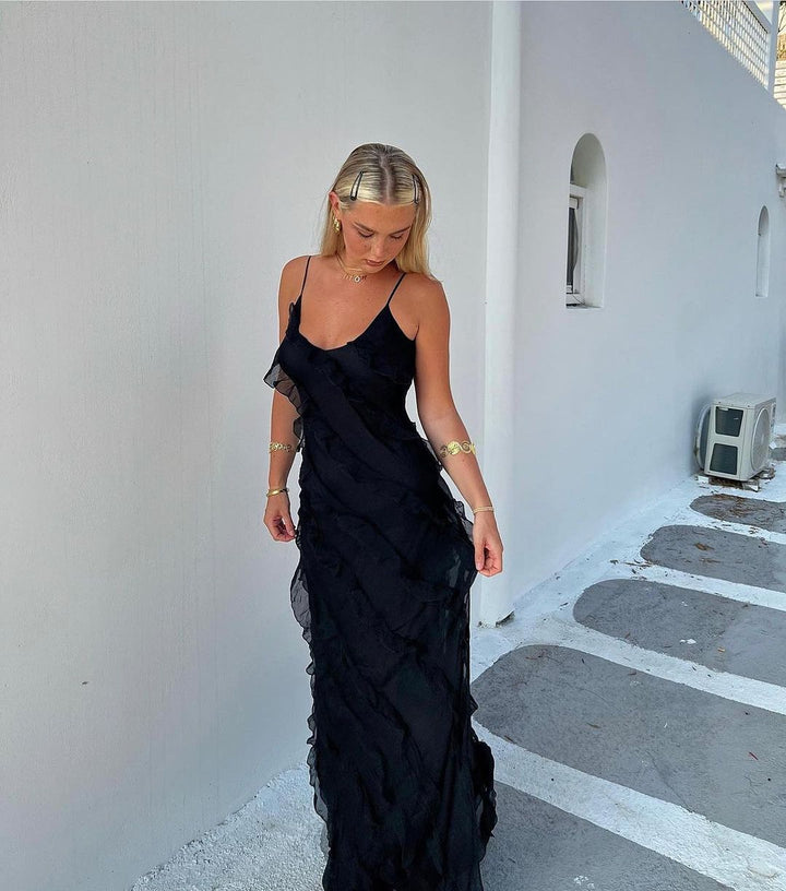Beautiful women's maxi dress with V-neck & ruffles, suitable for elegant evenings & formal events.