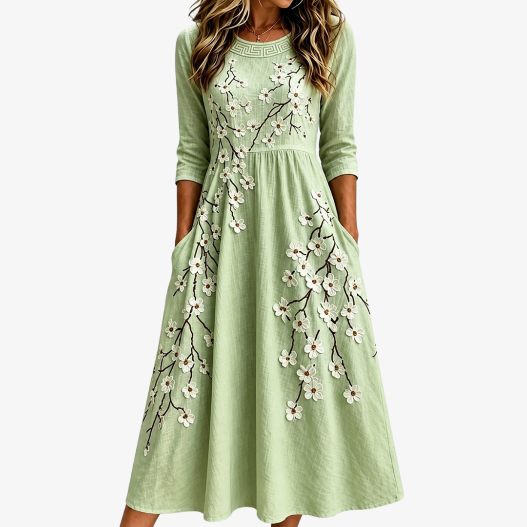Elegant women's sage floral midi dress with a garden blossom print, perfect for summer & spring everyday wear. Relaxed fit, pockets.