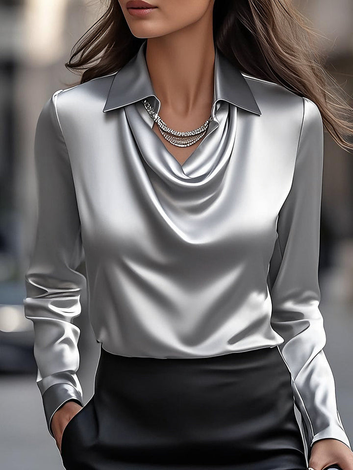 Elegant and comfortable women's satin blouse with a beautiful draped neckline, perfect for sophisticated style.