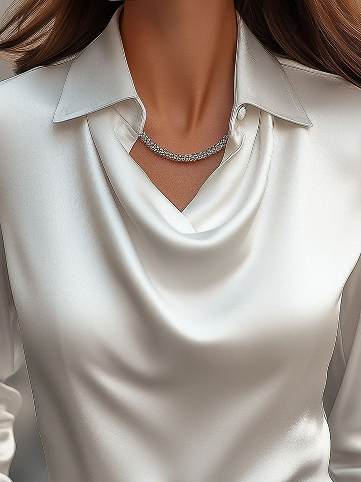 Refined ladies' long-sleeve satin blouse featuring a stylish draped neck, ideal for chic fashion.