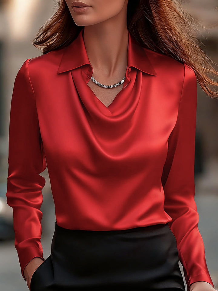 Women's elegant satin blouse with a draped neckline. Refined long-sleeve ladies' top for chic style.