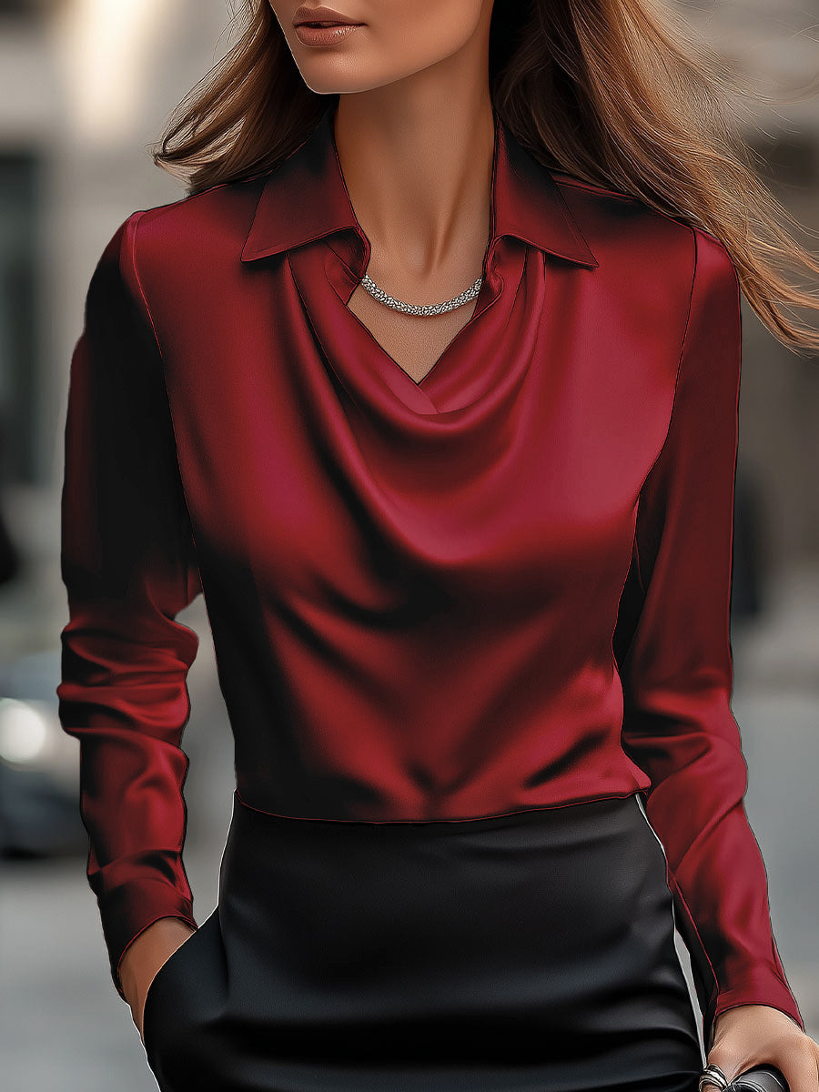 Flowing draped neck satin blouse for women. A refined long-sleeve top offering elegant style and comfort.