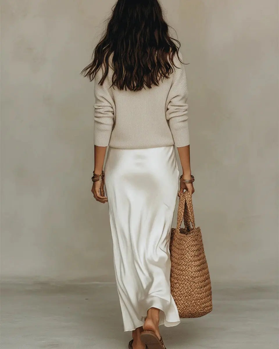 Trendy women's two-piece set: Sophisticated satin V-neck midi dress with a cozy jumper for a chic layered autumn outfit.