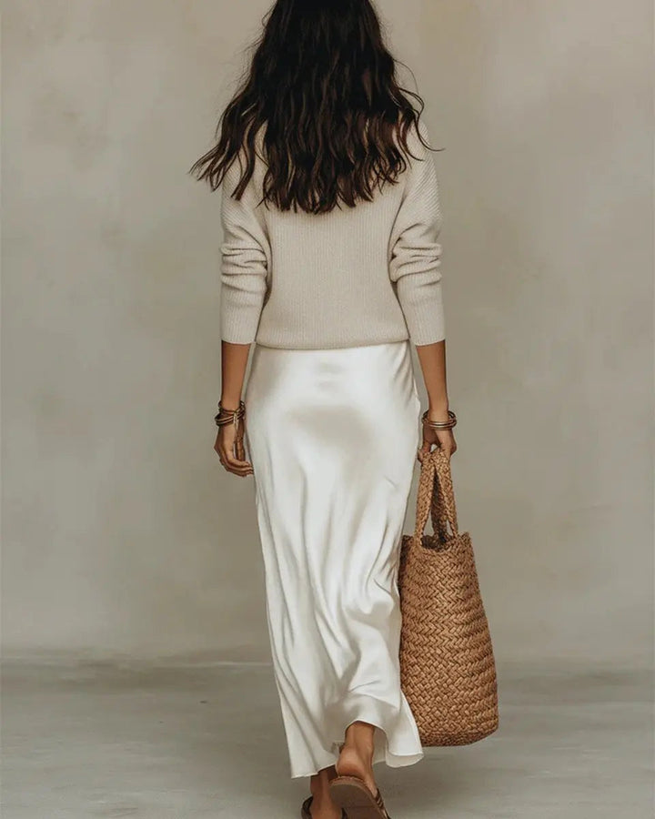 Trendy women's two-piece set: Sophisticated satin V-neck midi dress with a cozy jumper for a chic layered autumn outfit.