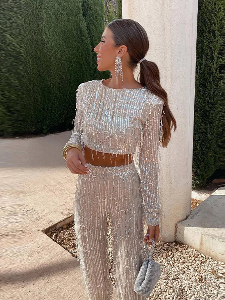 Elegant women's sequin top & high-waist trouser set. Perfect two-piece evening outfit.