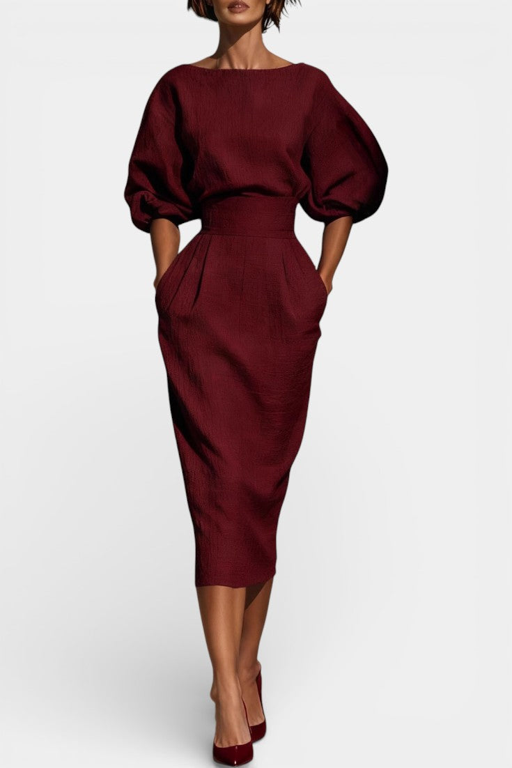 Elegant women's sheath midi dress with stylish lantern sleeves & tapered hem, perfect for formal occasions.